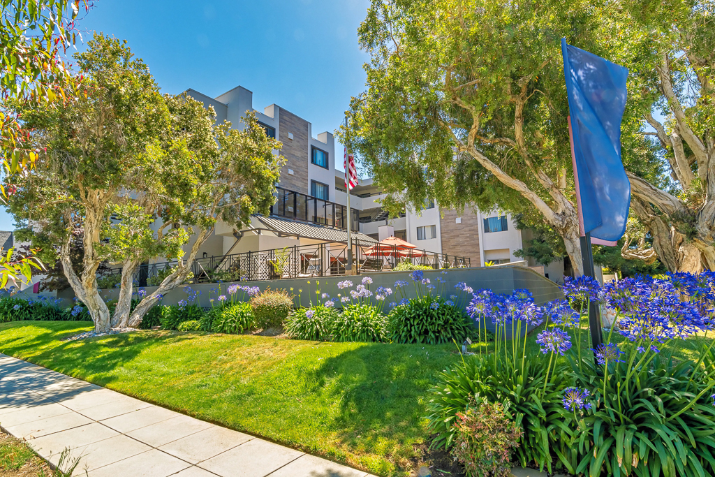 outside of building with greenery and flowers
